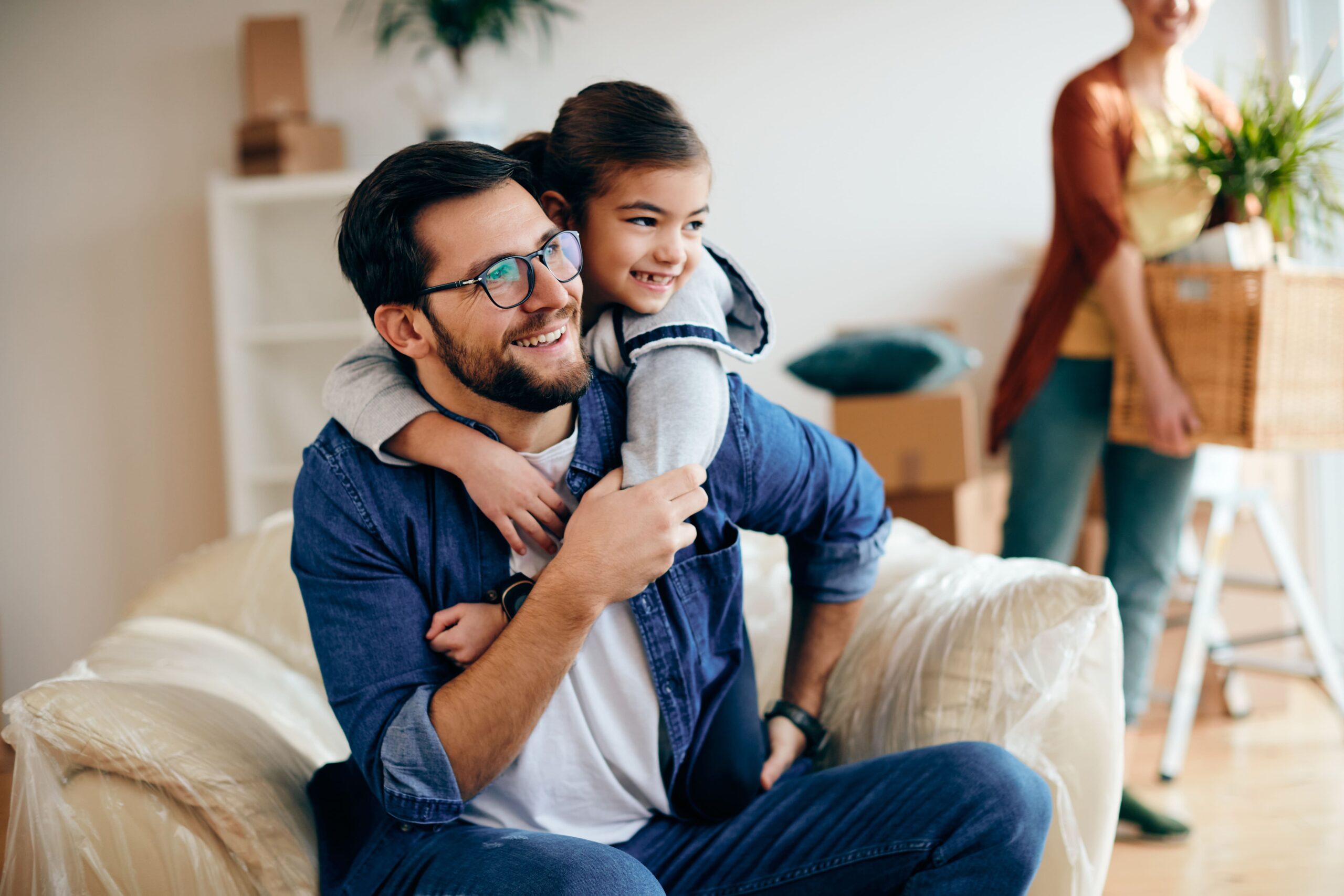 embraced-father-daughter-enjoying-their-new-home (2)